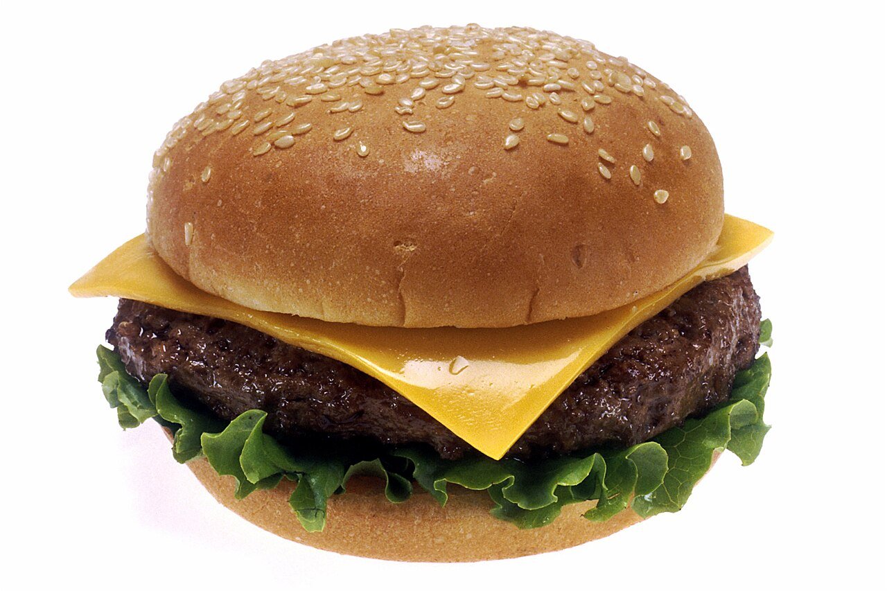 Cheeseburger with lettuce, tomato and cheese on a bun